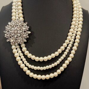 Elegant Pearl Necklace with Silver Floral Accent